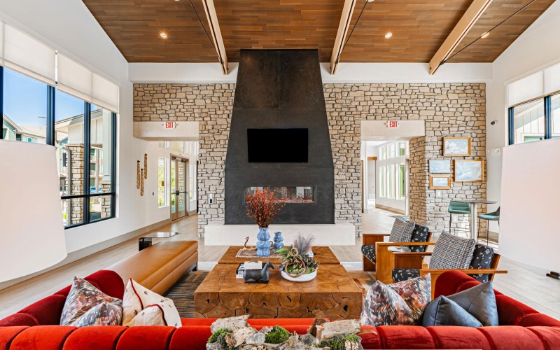 a spacious room with a fire place